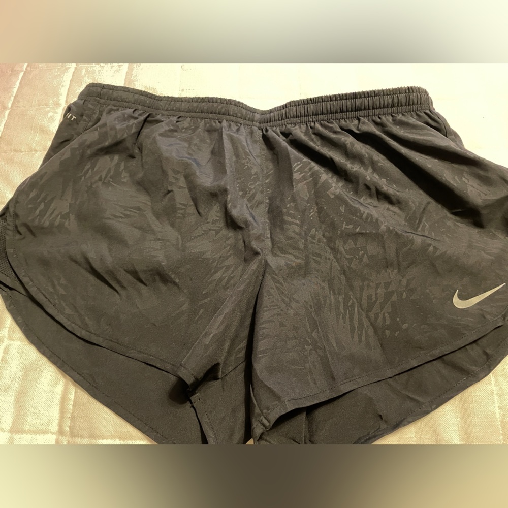 Ladies Nike run shorts. Black with soft pattern. Large like new.